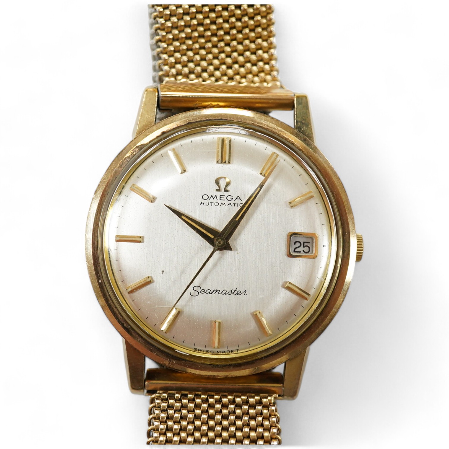 A gentleman's 9ct gold Omega Seamaster Automatic wrist watch, with baton numerals and date aperture, on an associated flexible bracelet, case diameter 35mm. Condition - fair